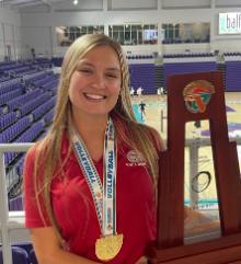 Melissa-Gutheil-DAT student holds state volleyball trophy