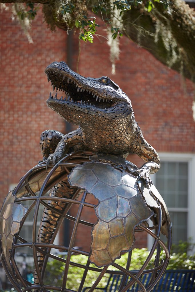 Gator on globe statue