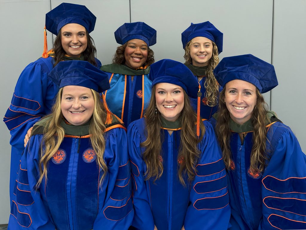 2025 DAT graduates pose together for a picture